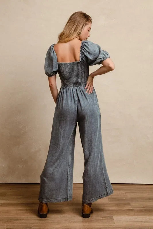 BiBi Smocked Washed Puff Sleeve Square Neck Denim Jumpsuit - Codrington Expressions