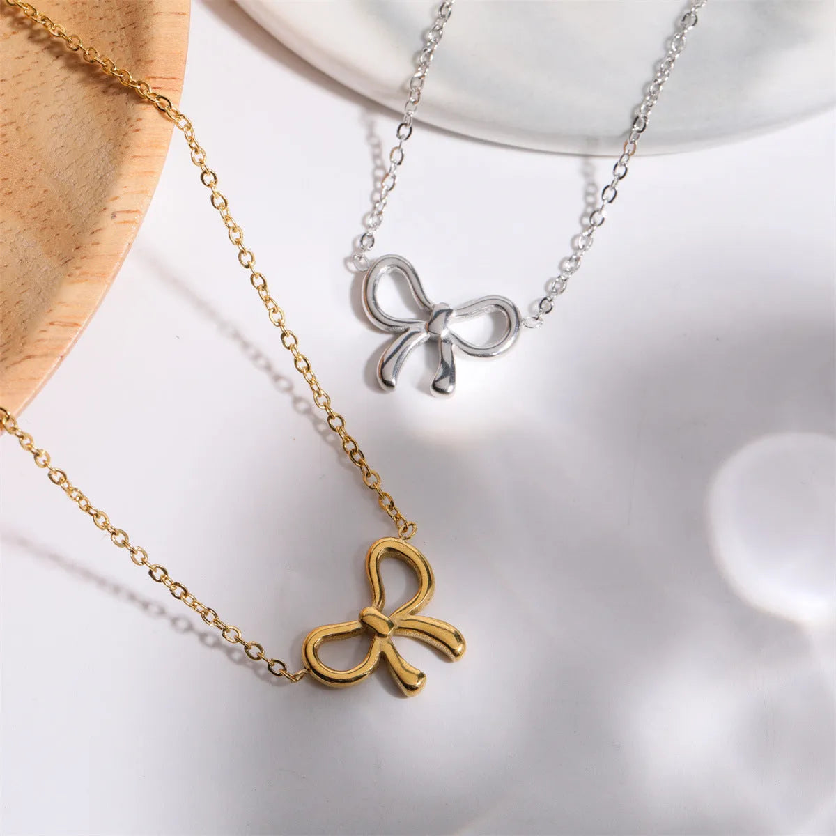 Titanium Steel Bow Pendant Necklace - Codrington Expressions