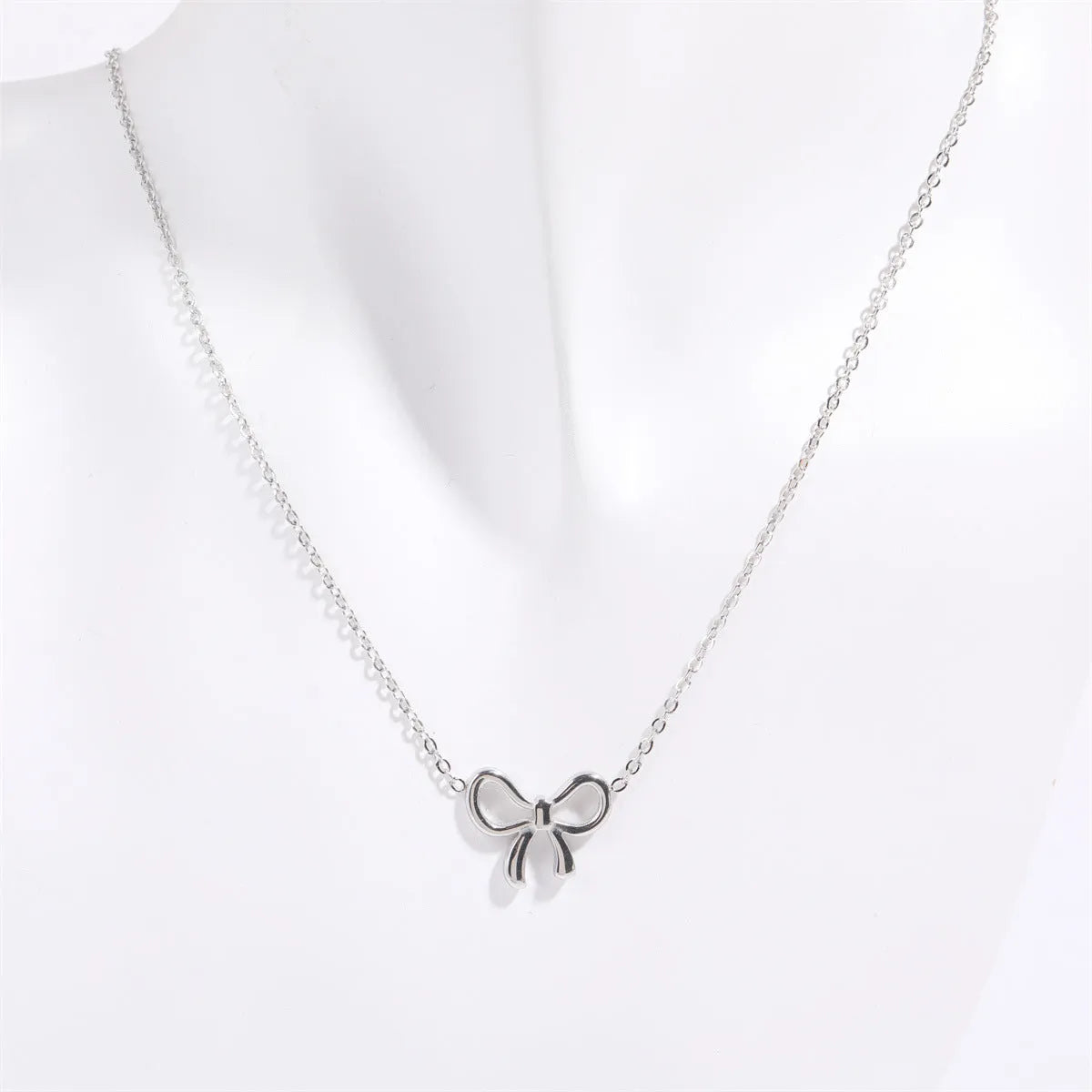 Titanium Steel Bow Pendant Necklace - Codrington Expressions