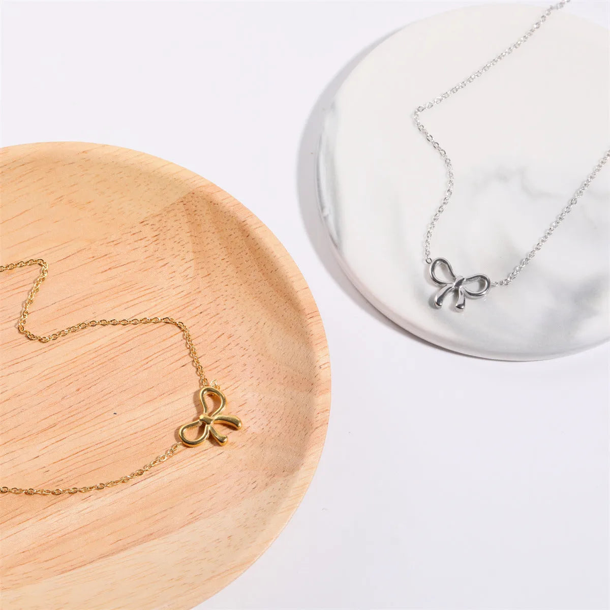 Titanium Steel Bow Pendant Necklace - Codrington Expressions